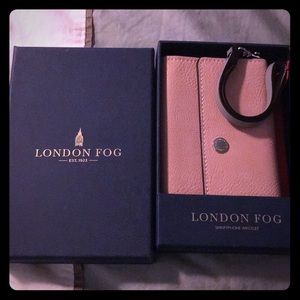 London Fog soft pink leather smartphone wristlet.